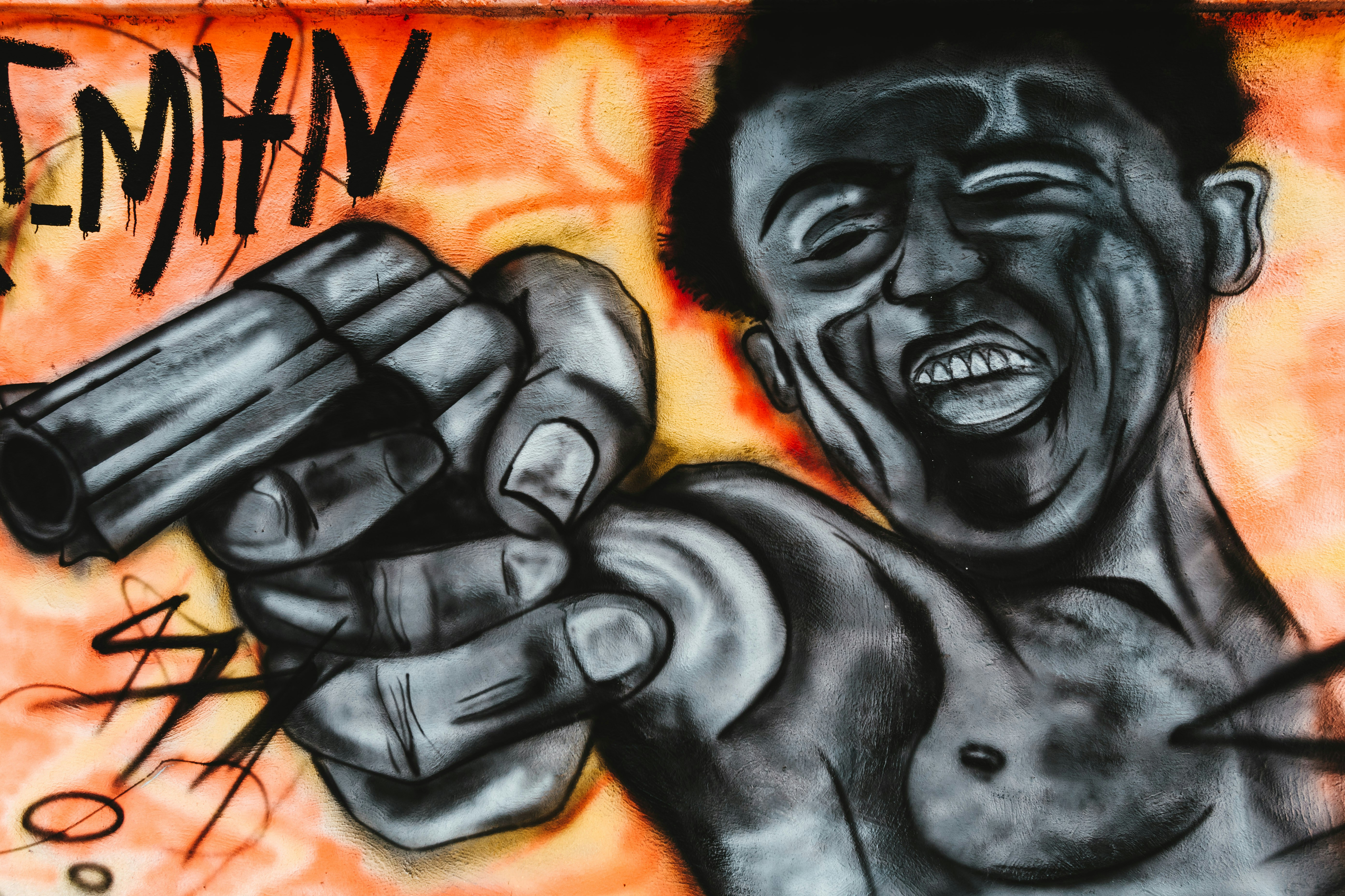 graffiti of a black man holding a gun