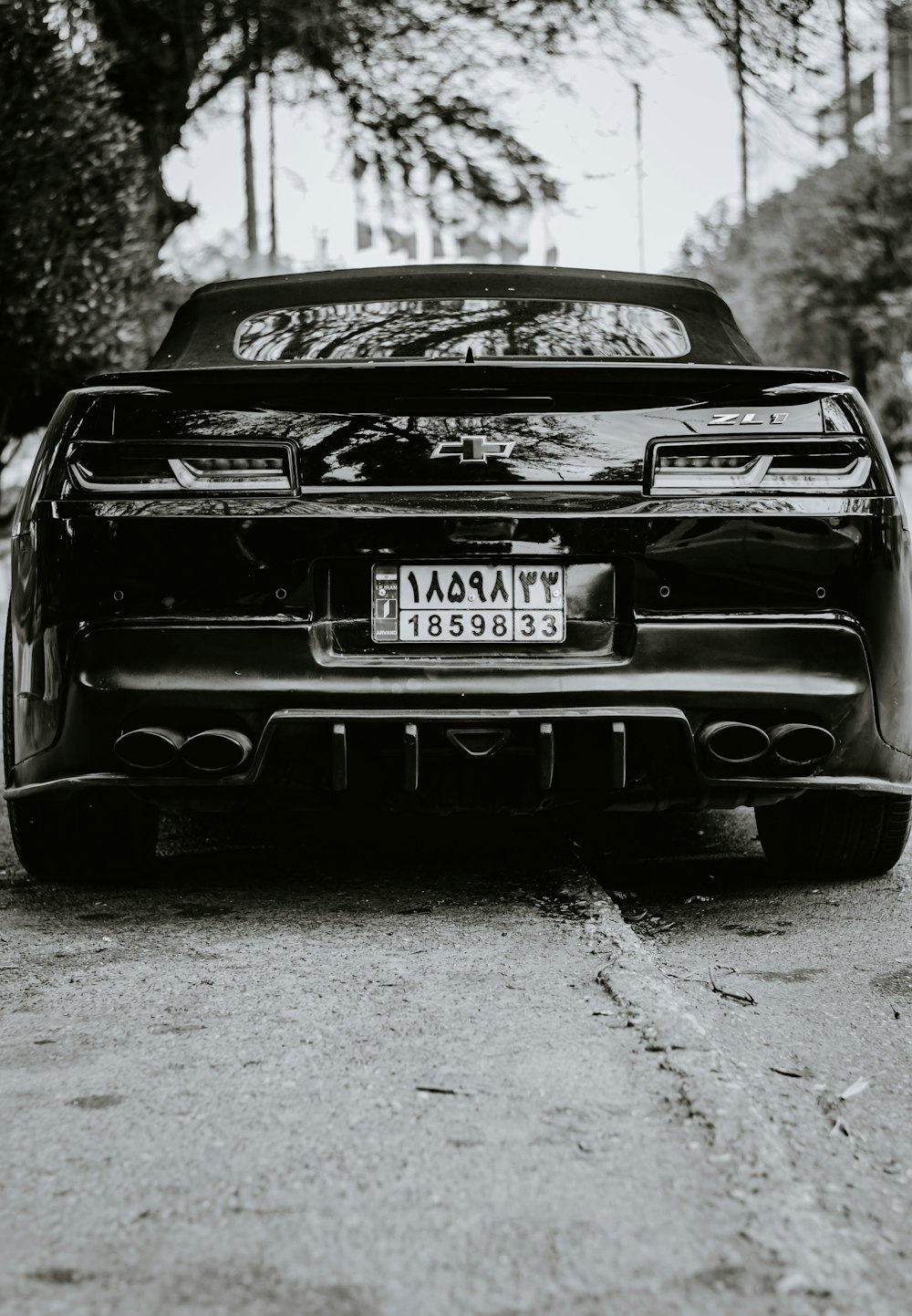 grayscale photo of black bmw car