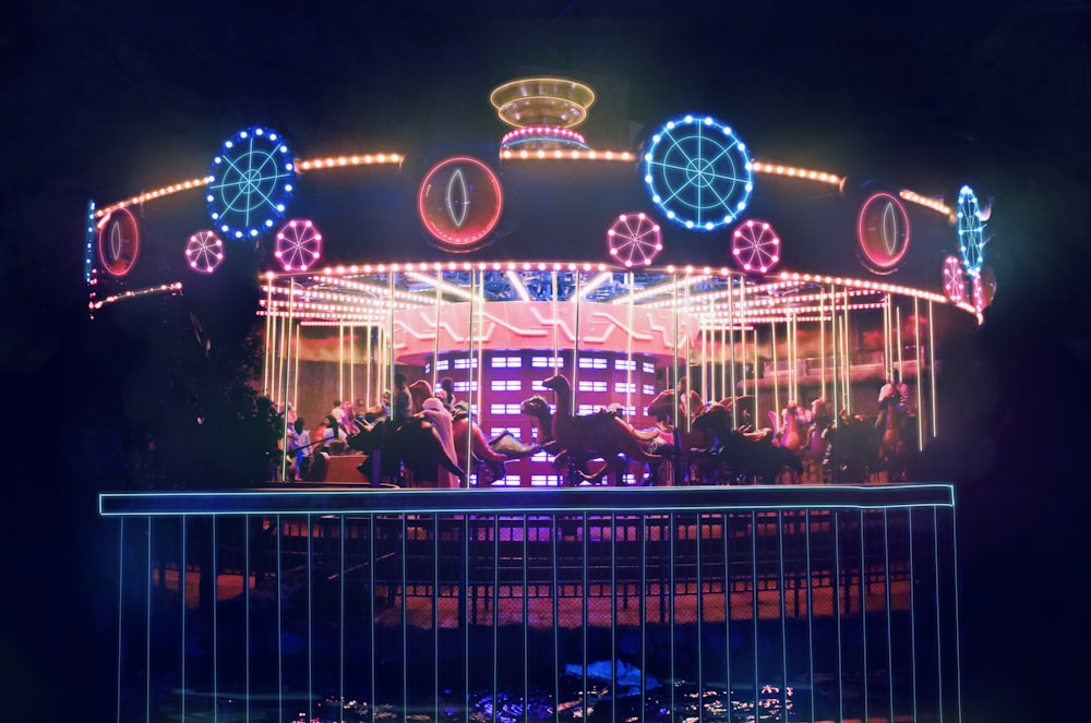 blue and white lighted carousel during night time