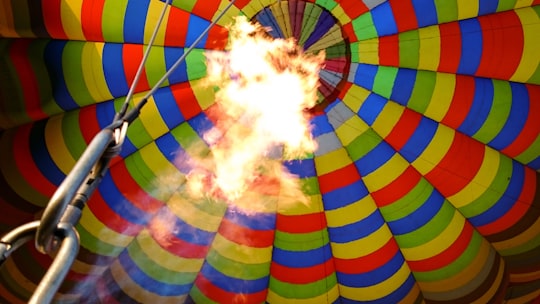 white blue green and red hot air balloon in Magaliesberg South Africa