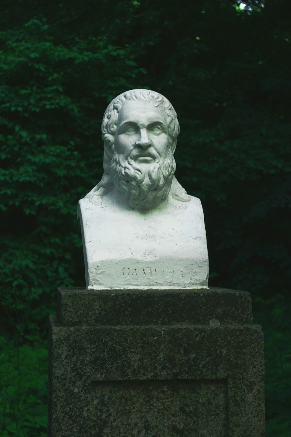 white concrete statue of man