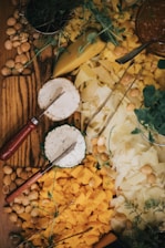 white and brown round decor beside red and yellow hand tool