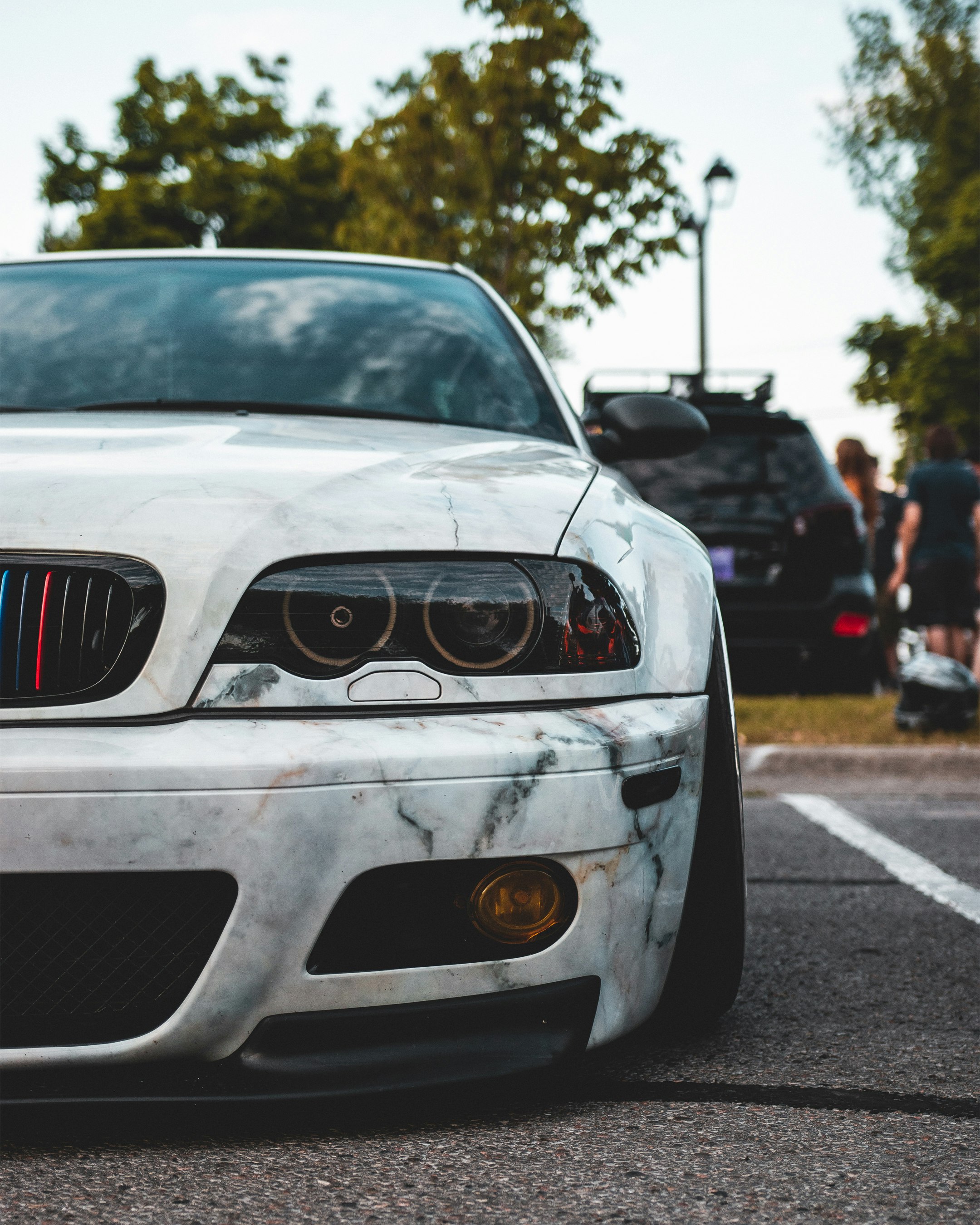 white bmw m 3 on road during daytime