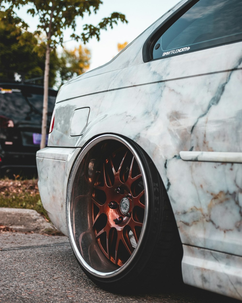 white car with red wheel