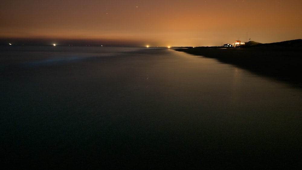 body of water during sunset