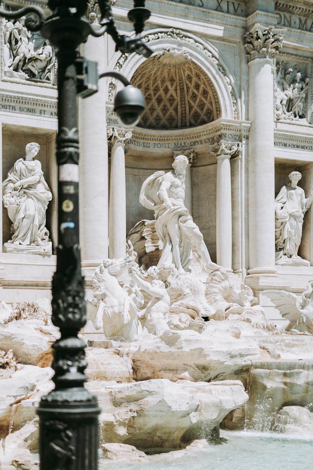 white concrete statue of man and woman