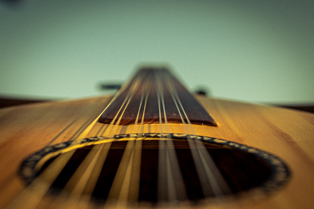 brown and black acoustic guitar