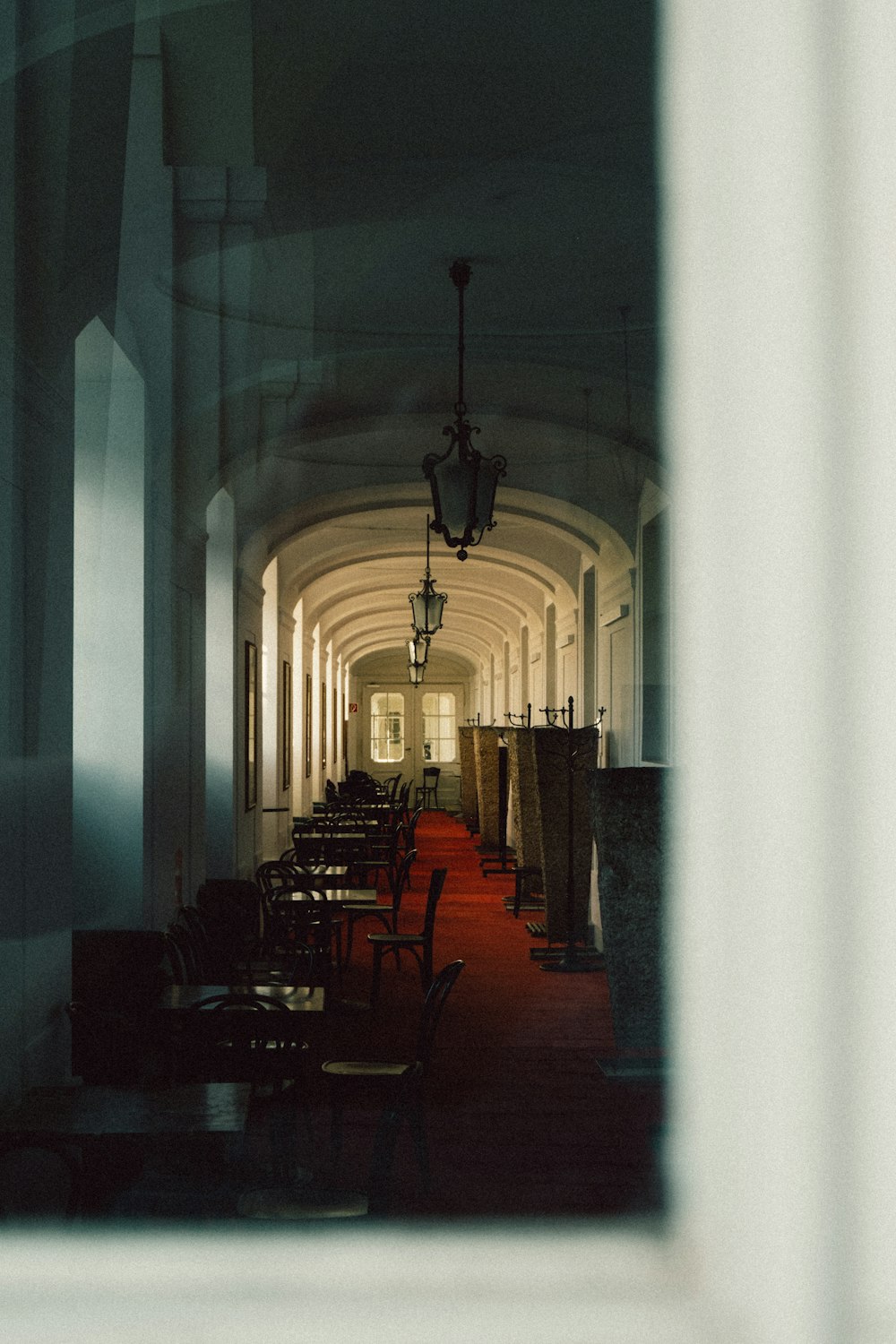 brown wooden chairs inside white room