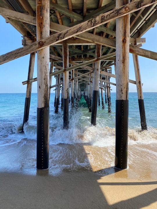 brown wooden dock on sea during daytime in Balboa Pier United States