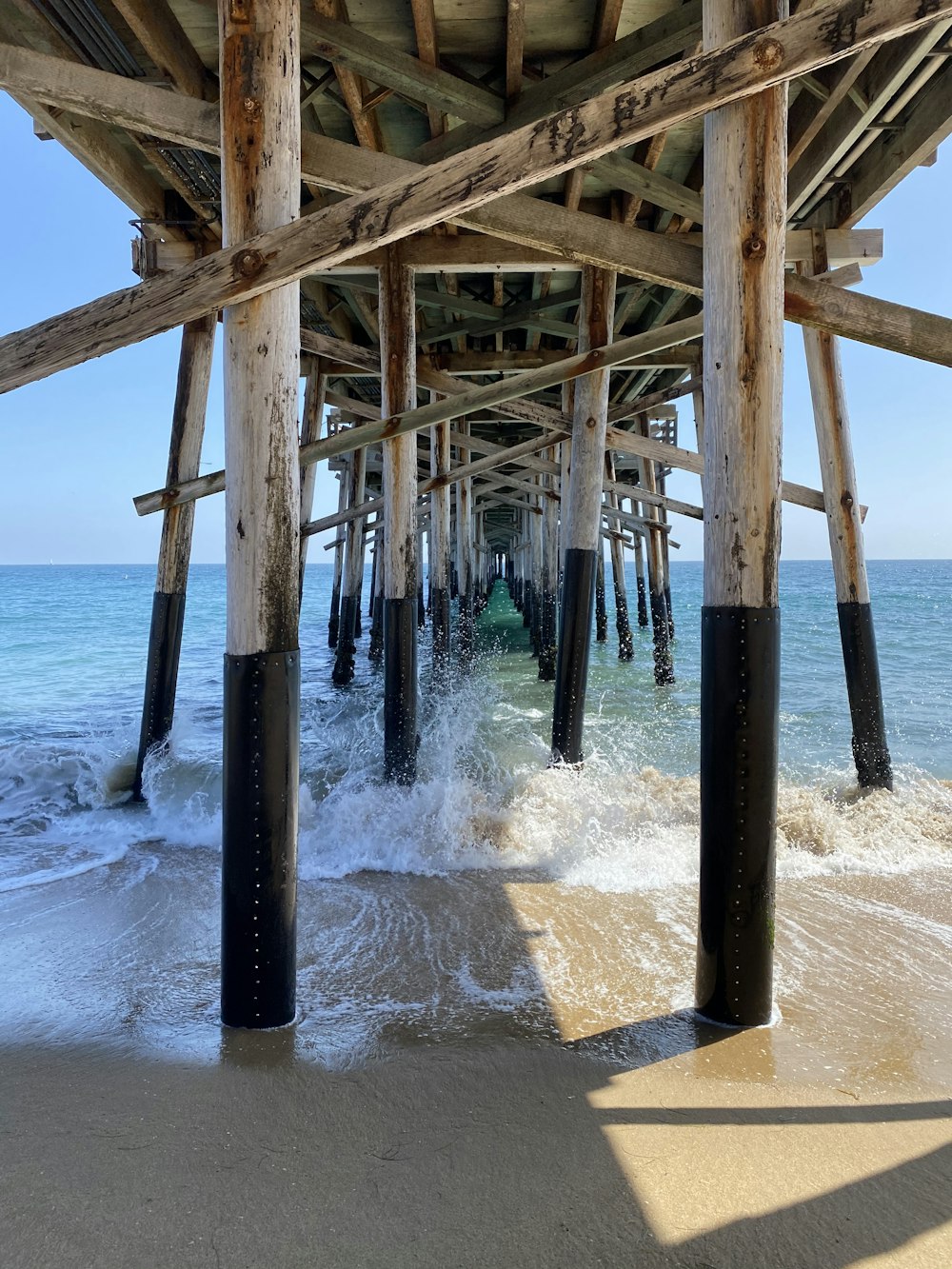 brown wooden dock on sea during daytime