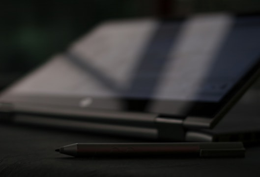 black and silver click pen