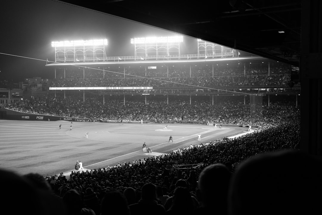 Hazy nighttime Cubs game at Wrigley Field.