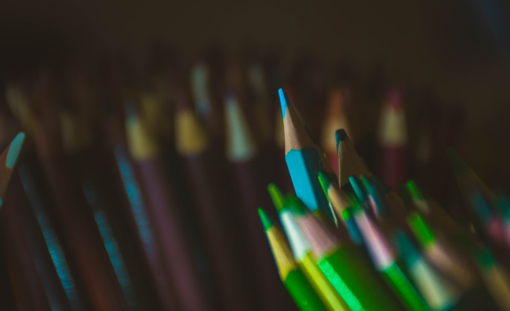 multi color coloring pencils in black background