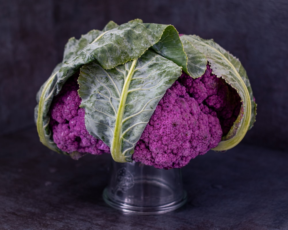 green and purple vegetable in clear glass jar