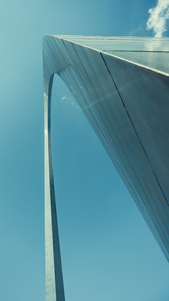 low angle photography of bridge under blue sky during daytime in St. Louis United States