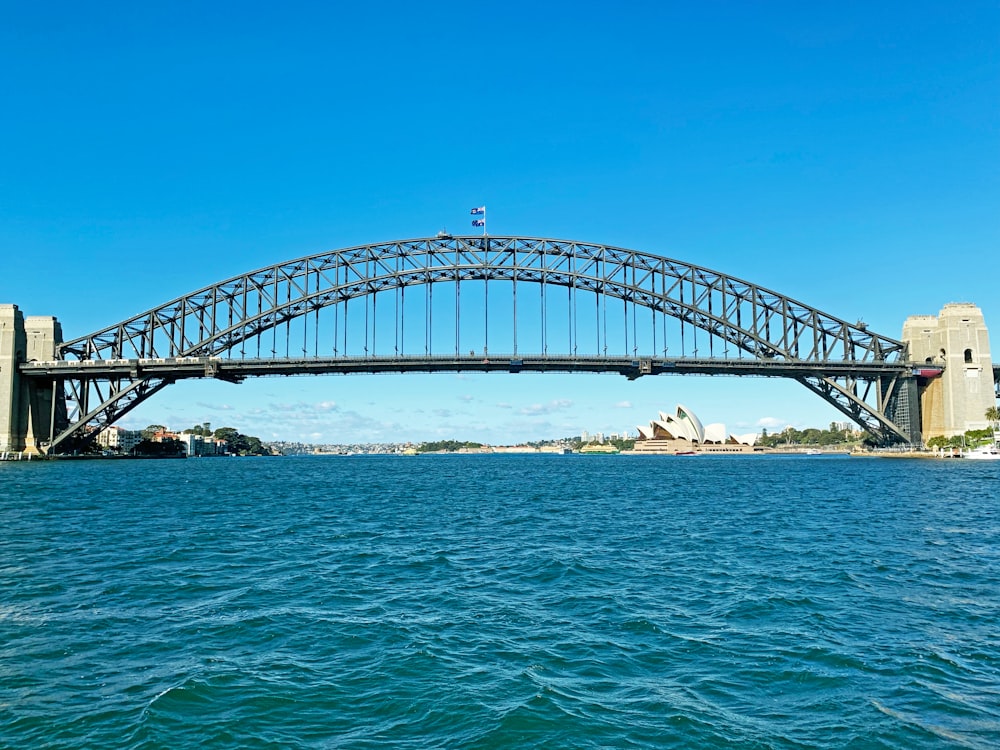 white bridge over the sea during daytime