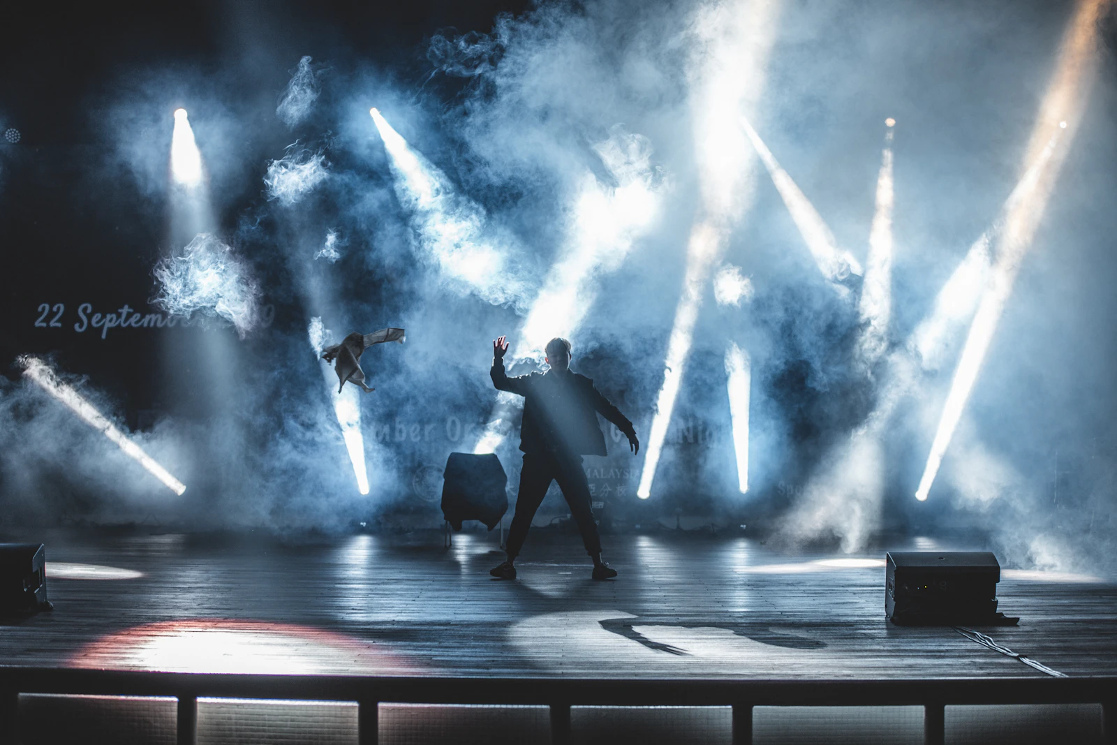 Dancers performing on stage during a music video shoot