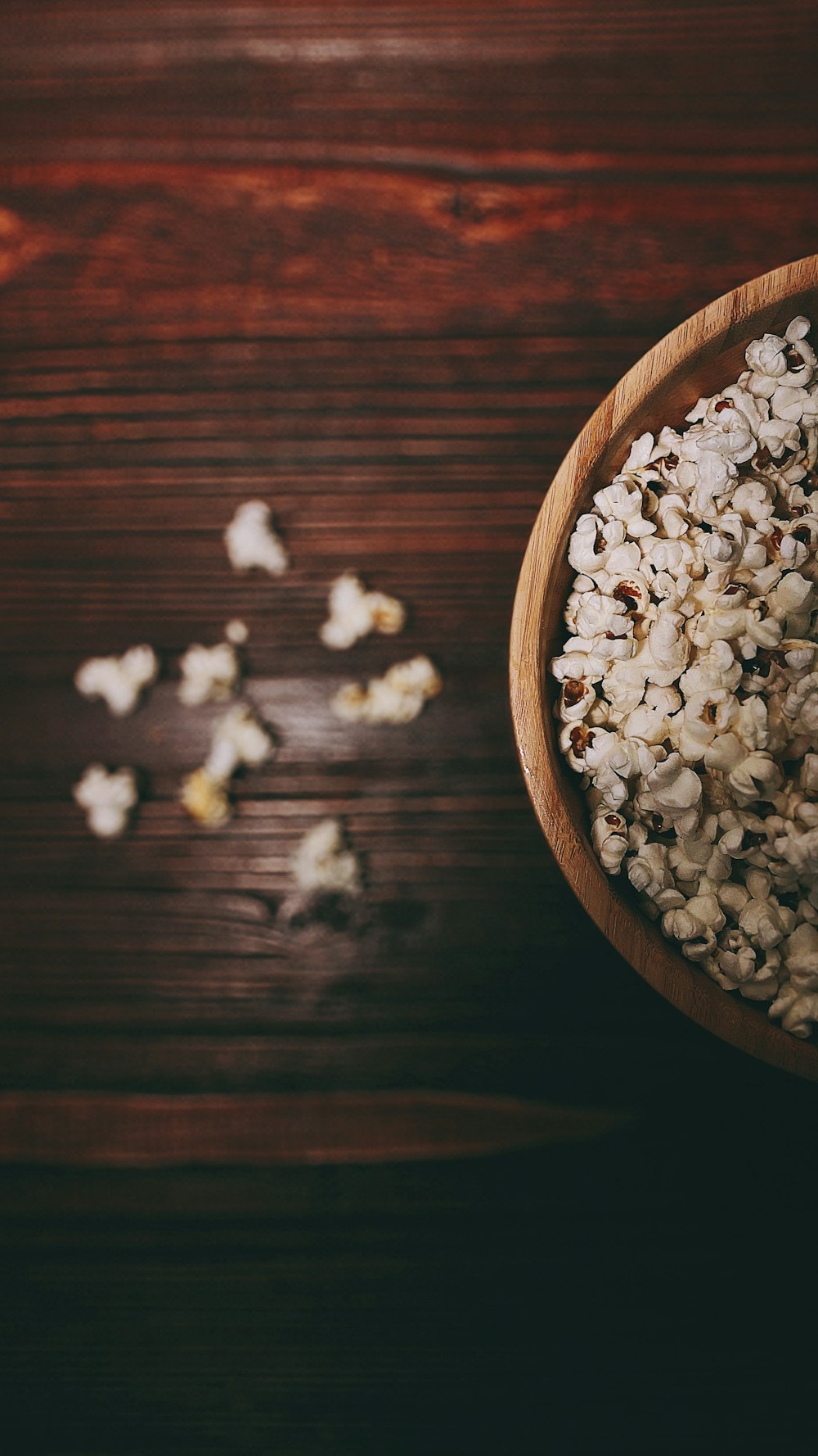 white popcorn on brown wooden table