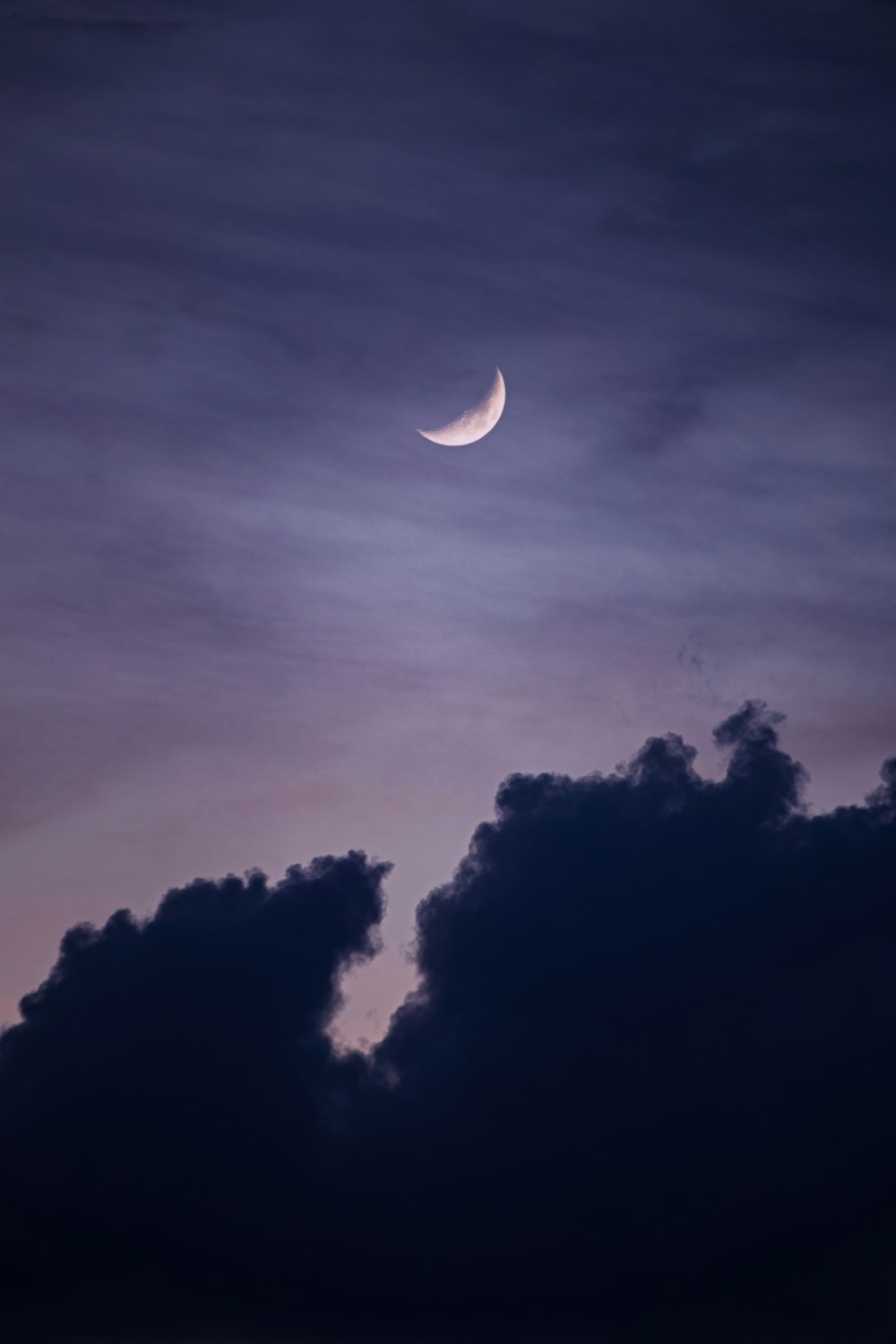 full moon covered by clouds