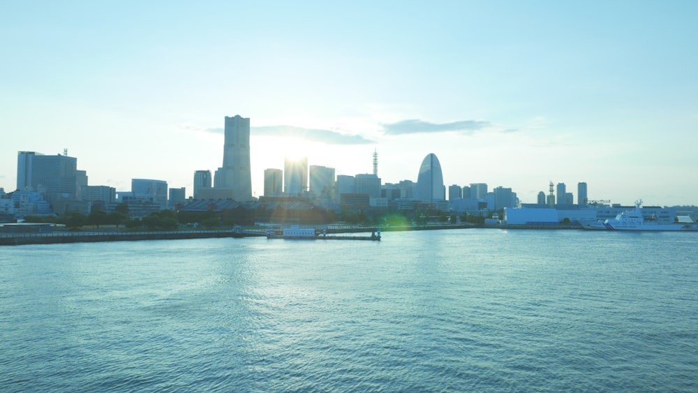 city skyline across body of water during daytime