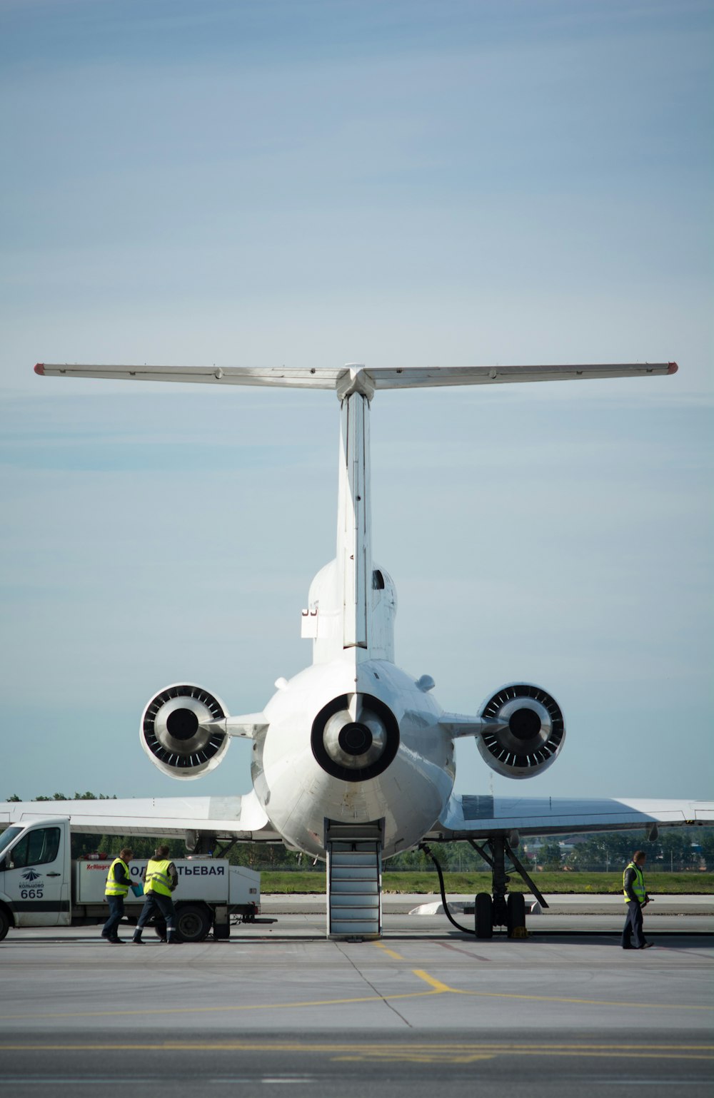 a large jetliner sitting on top of an airport tarmac