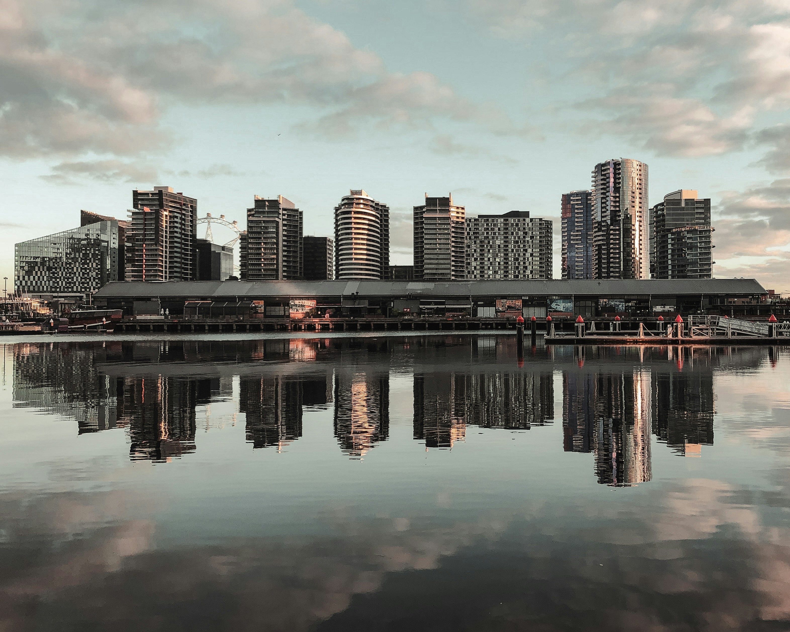 city skyline across body of water during daytime