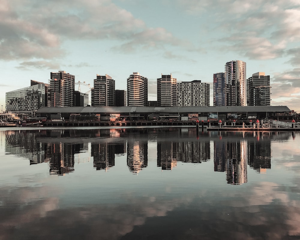 city skyline across body of water during daytime