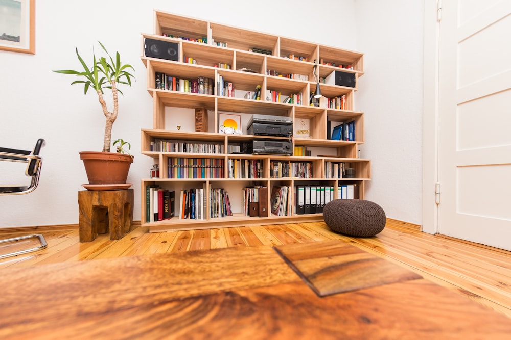 books on brown wooden shelf