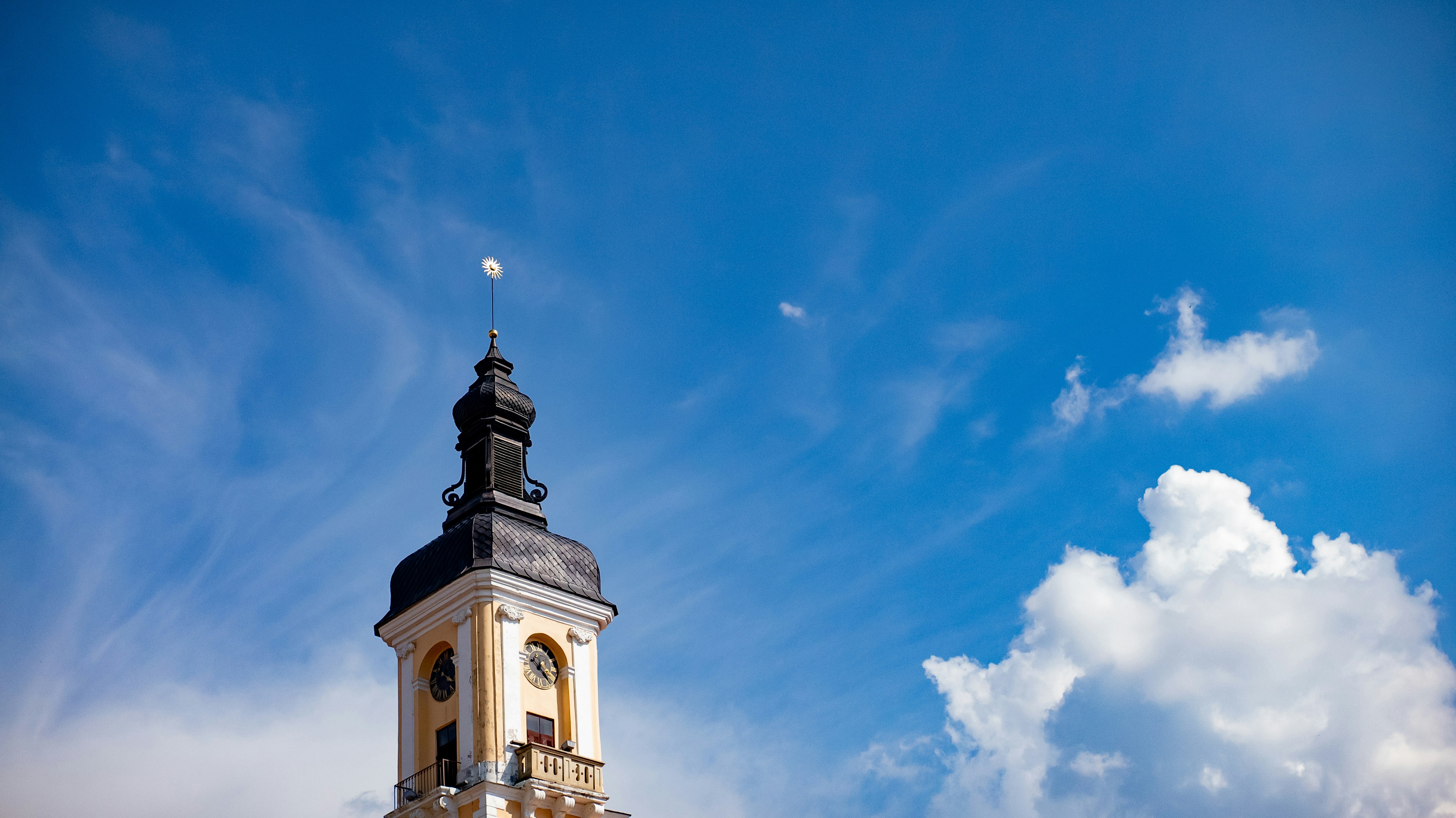 white and brown concrete building under blue sky during daytime