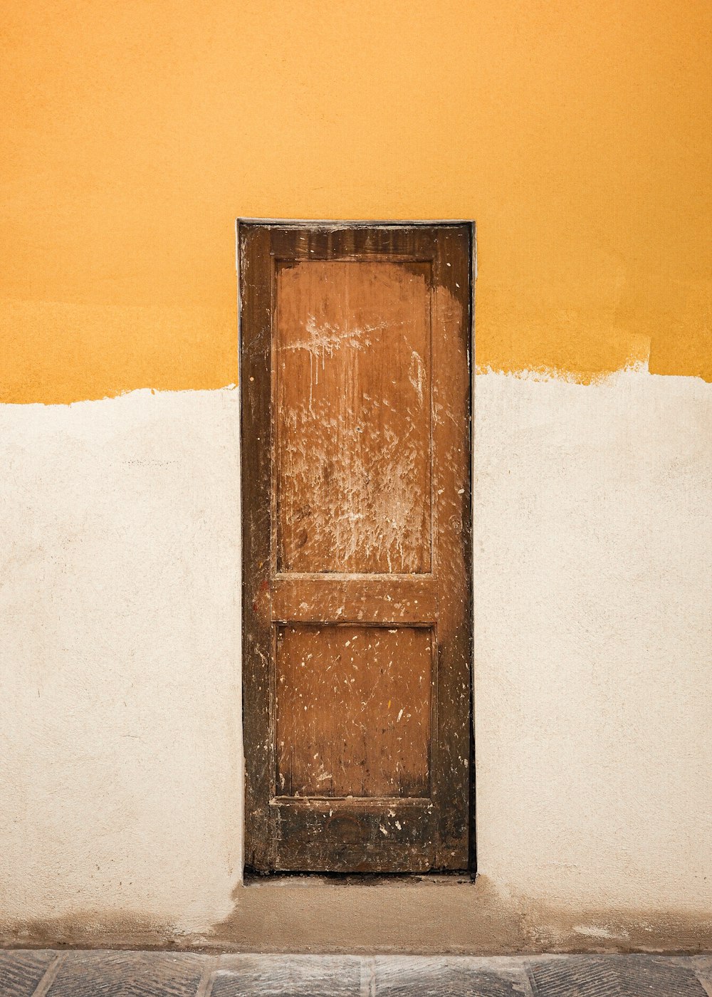 brown wooden door on white snow covered ground