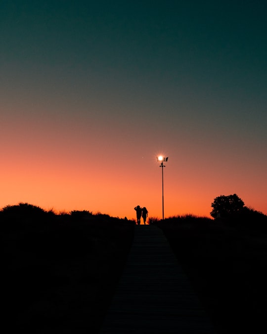 silhouette of people walking on pathway during sunset in Sunny Beach Bulgaria