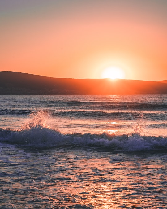 ocean waves crashing on shore during sunset in Sunny Beach Bulgaria