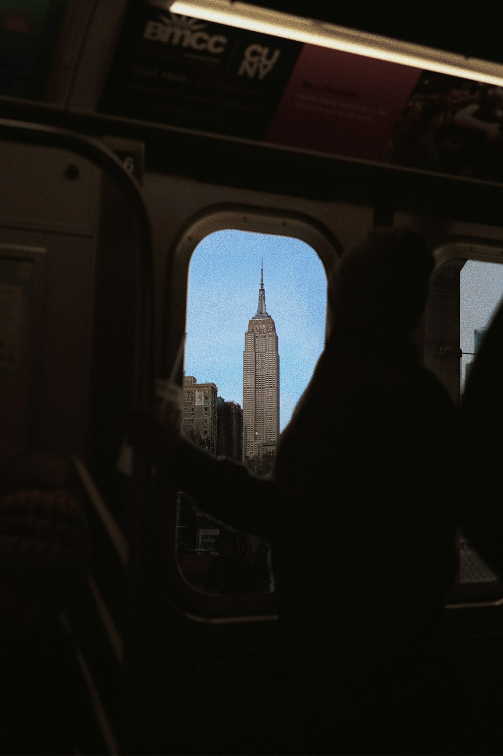 silhouette of man and woman sitting inside train