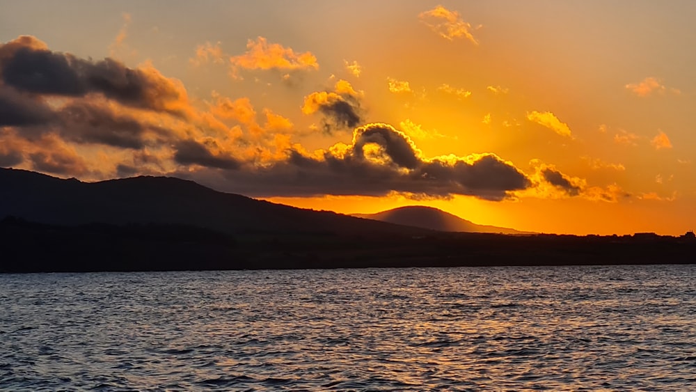 silhouette of mountain during sunset