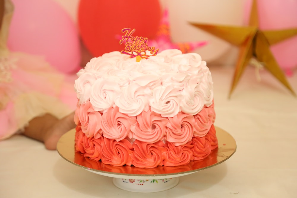 white and pink cake on white ceramic plate