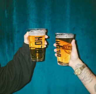 person holding clear drinking glass