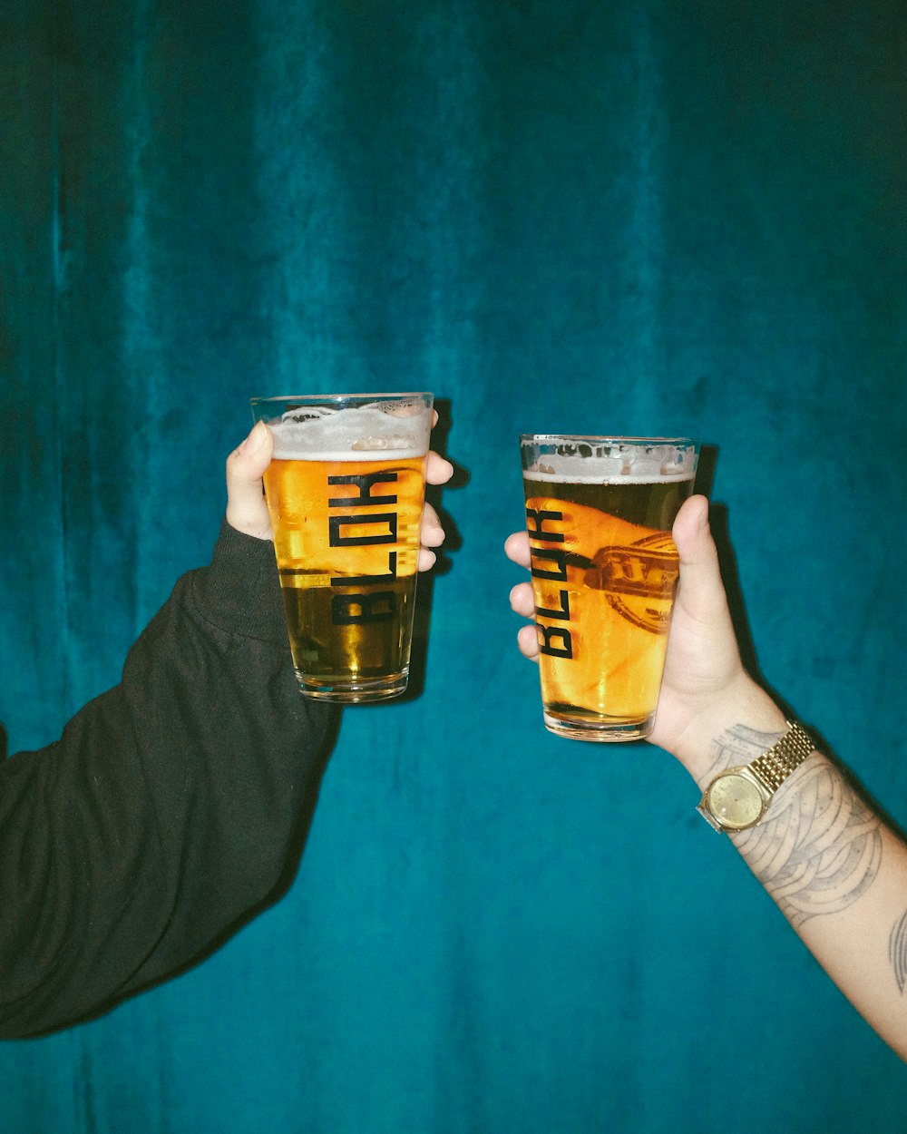 person holding clear drinking glass