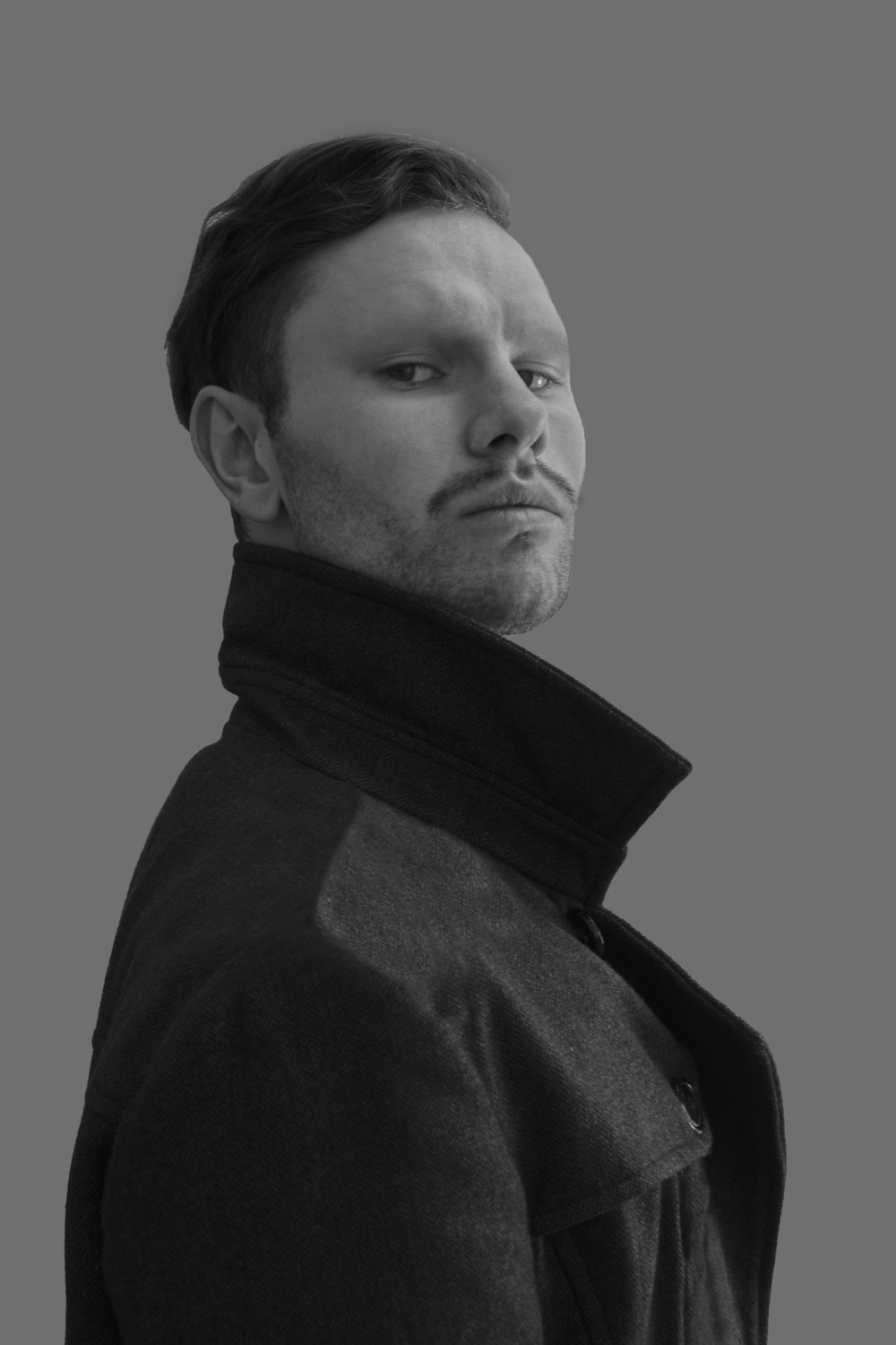 man in black coat grayscale photo