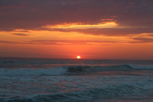 ocean waves crashing on shore during sunset in Bloubergstrand South Africa