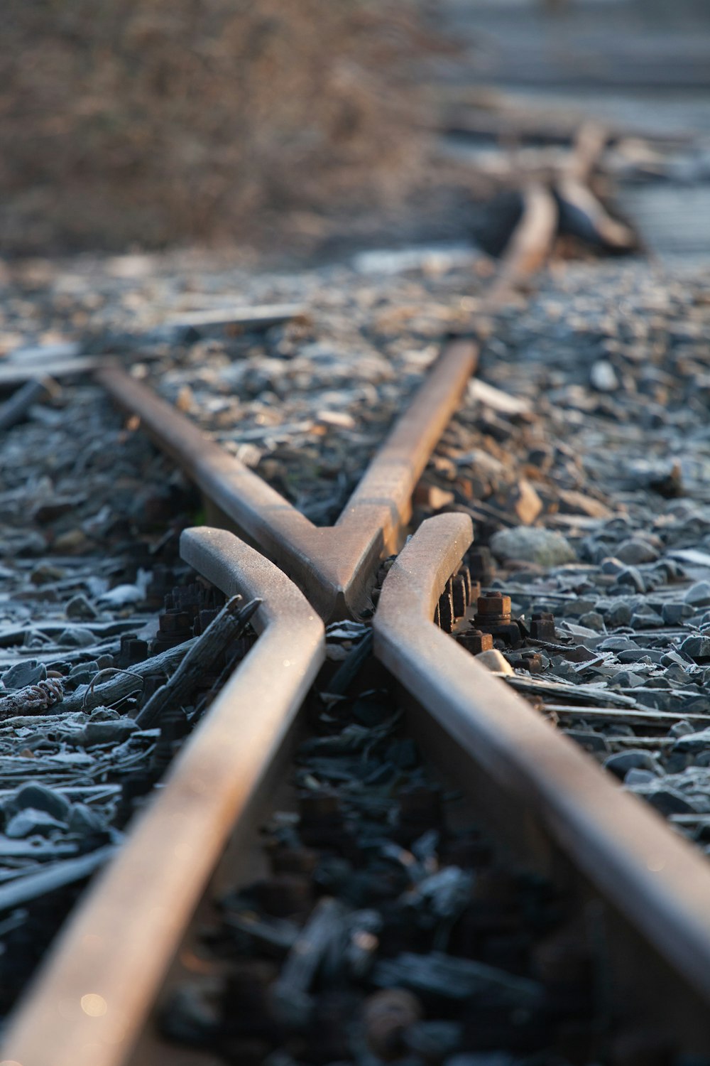 a close up of a train track with a cross on it