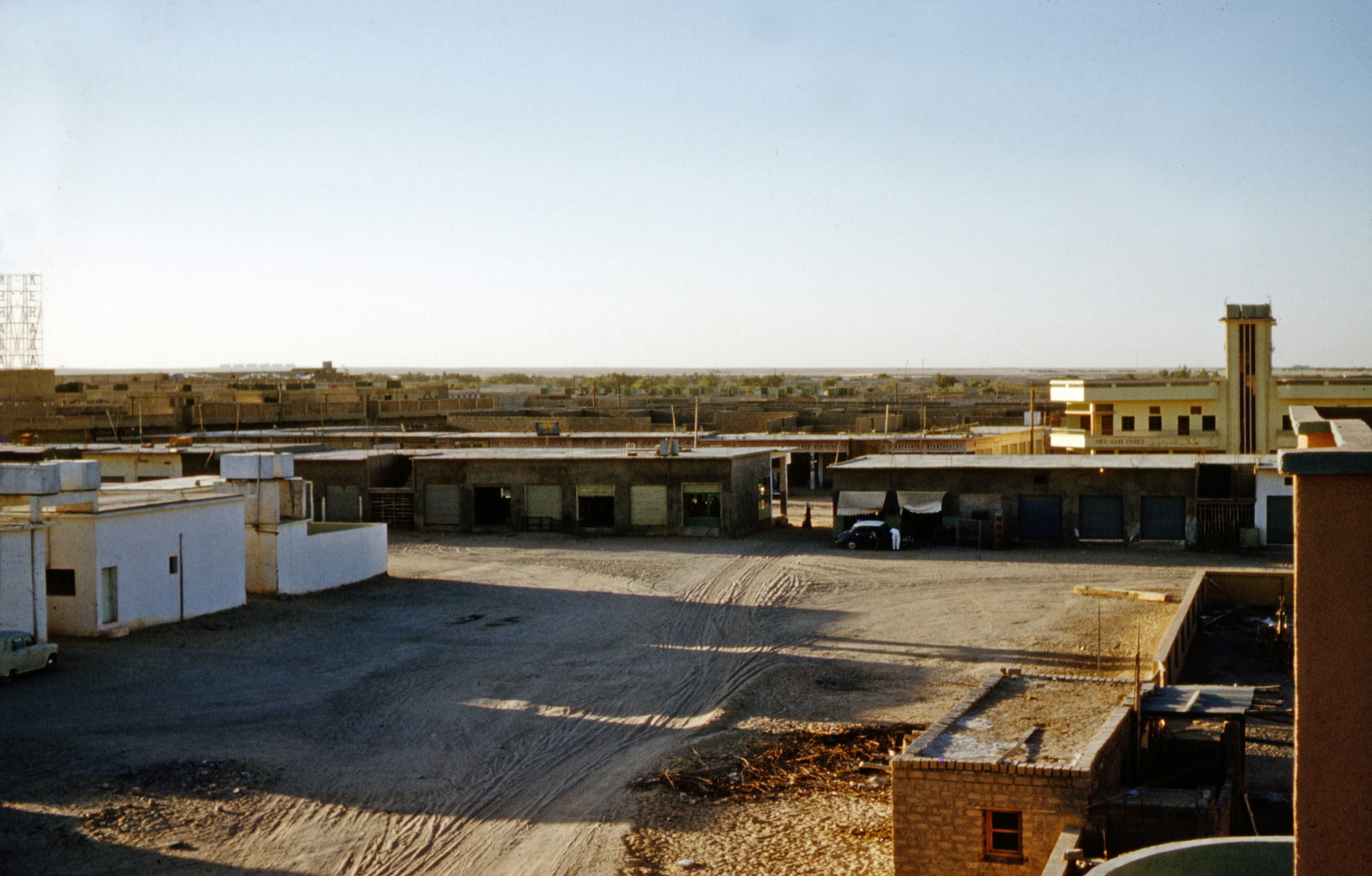 white and gray building under white sky during daytime kuwait teams background