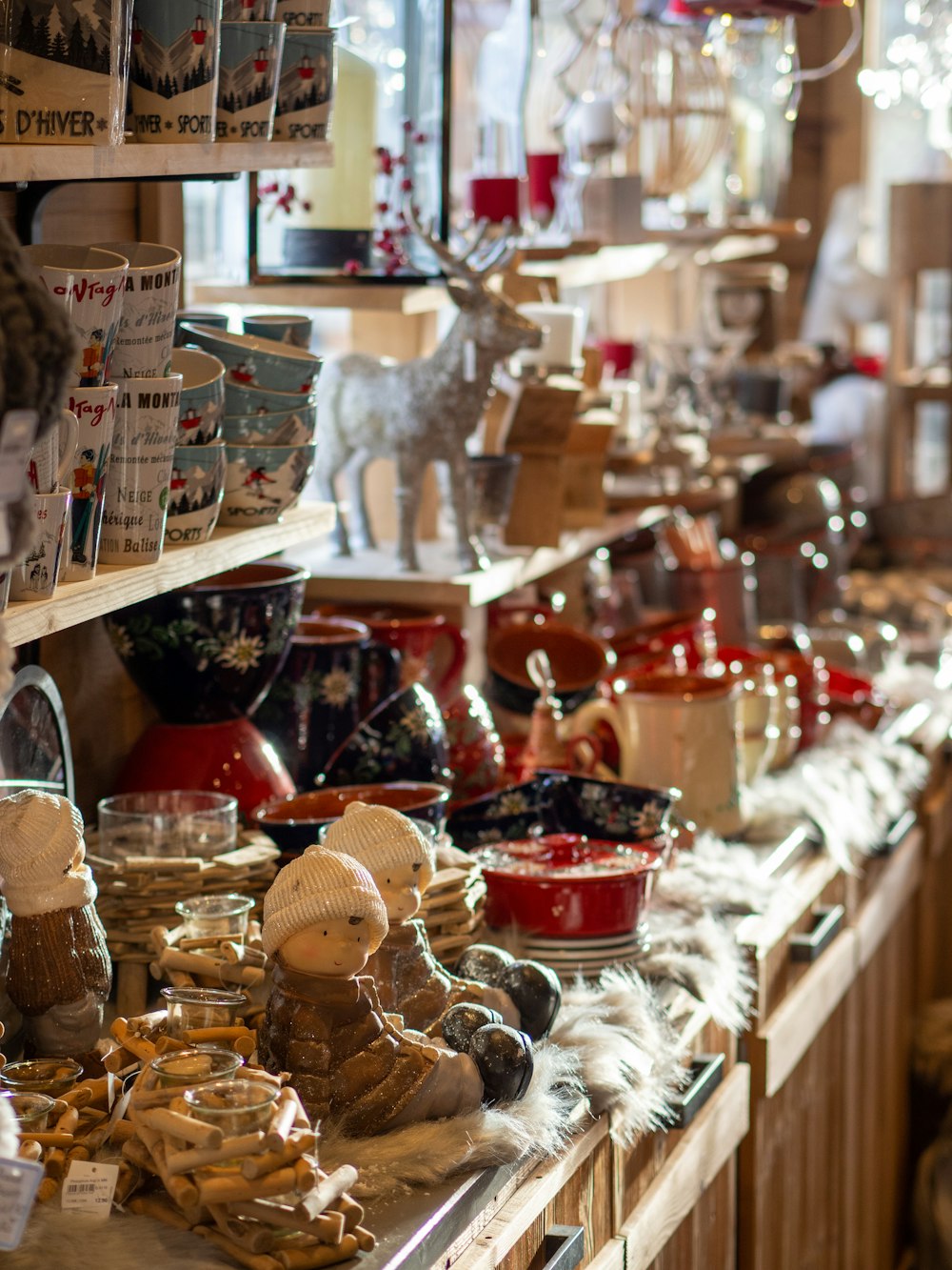 brown wooden shelf with assorted ornaments