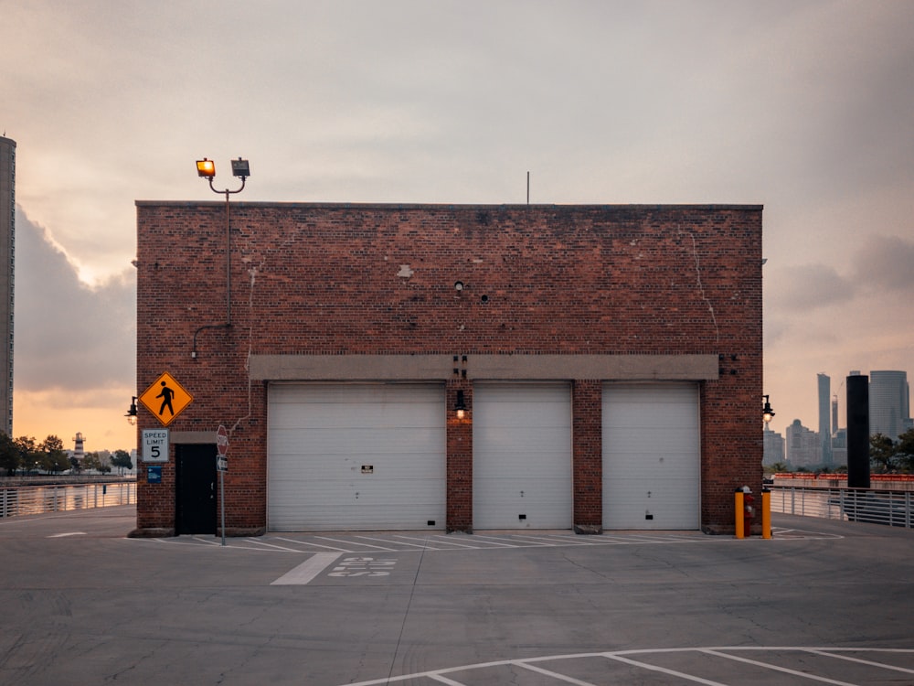 brown brick building with white and black street light