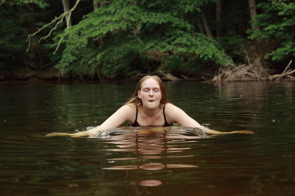 woman in body of water during daytime