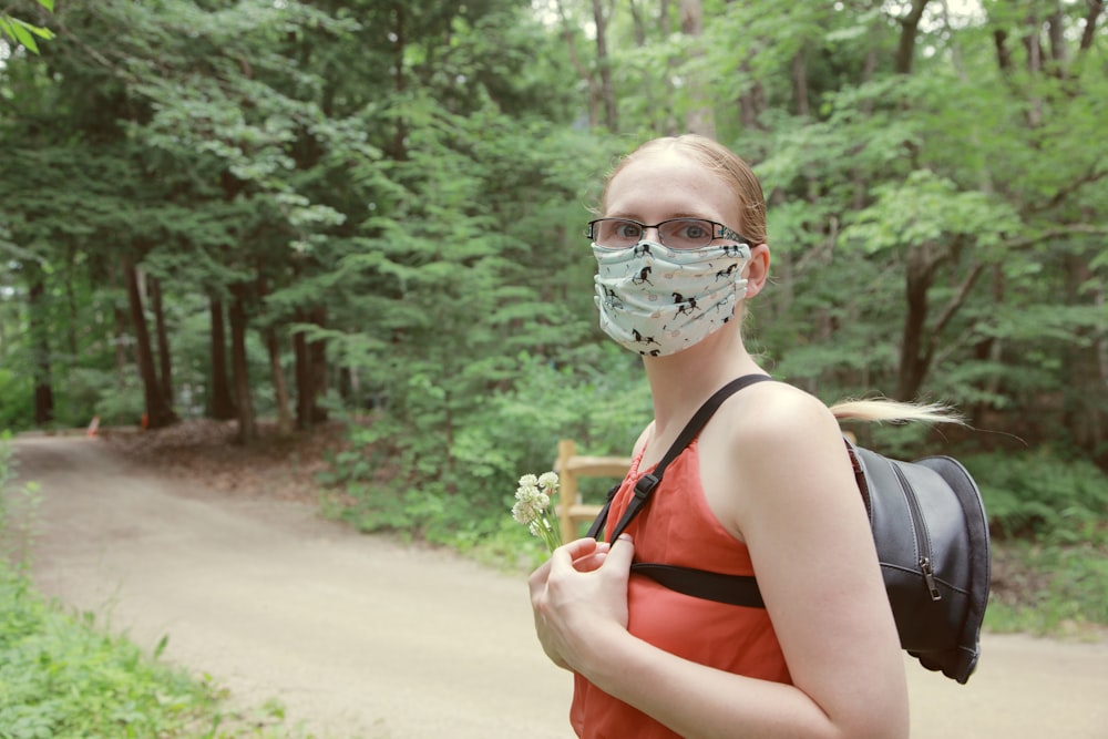 woman in black tank top wearing sunglasses