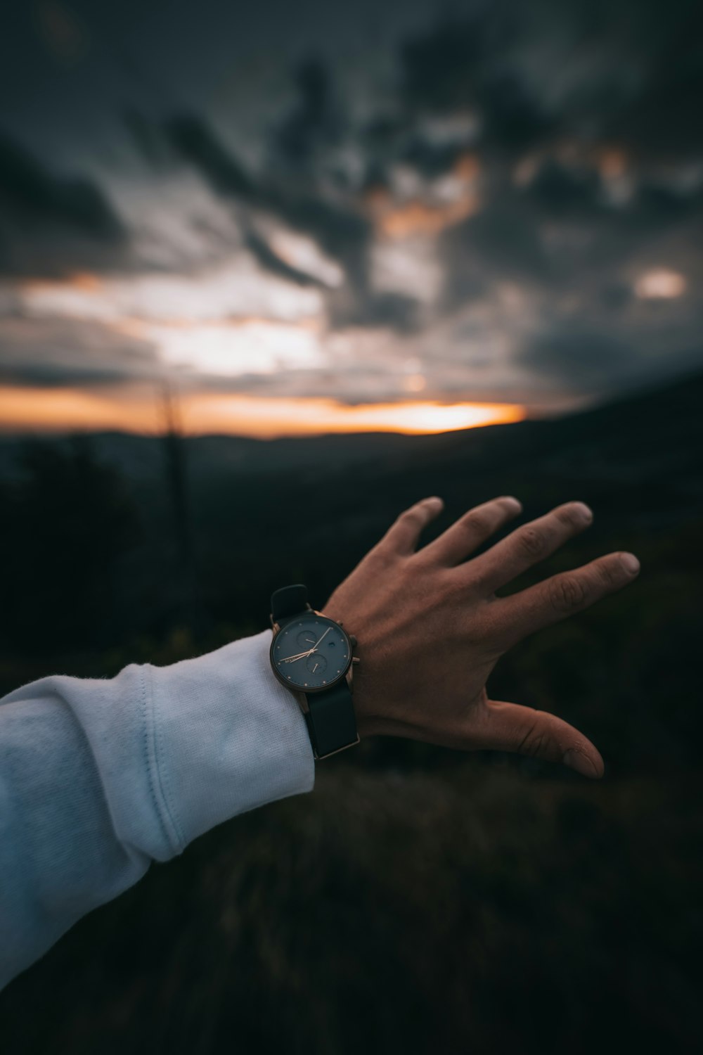 a person's hand with a watch on it