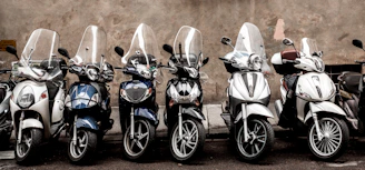 blue and white motor scooter
