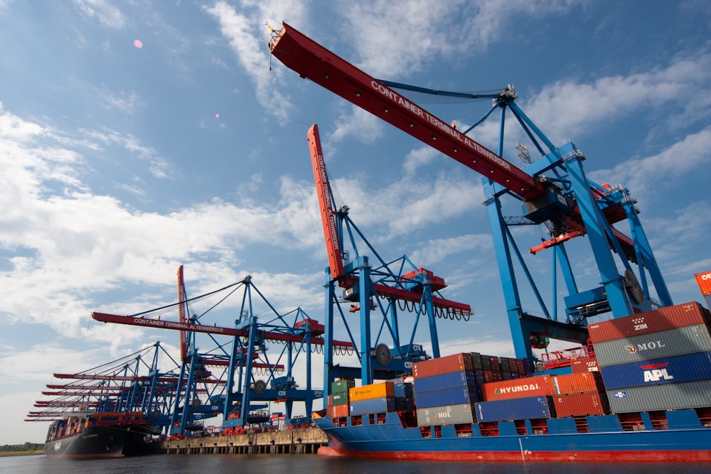 red and blue crane under blue sky during daytime