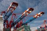 red and blue crane under blue sky during daytime