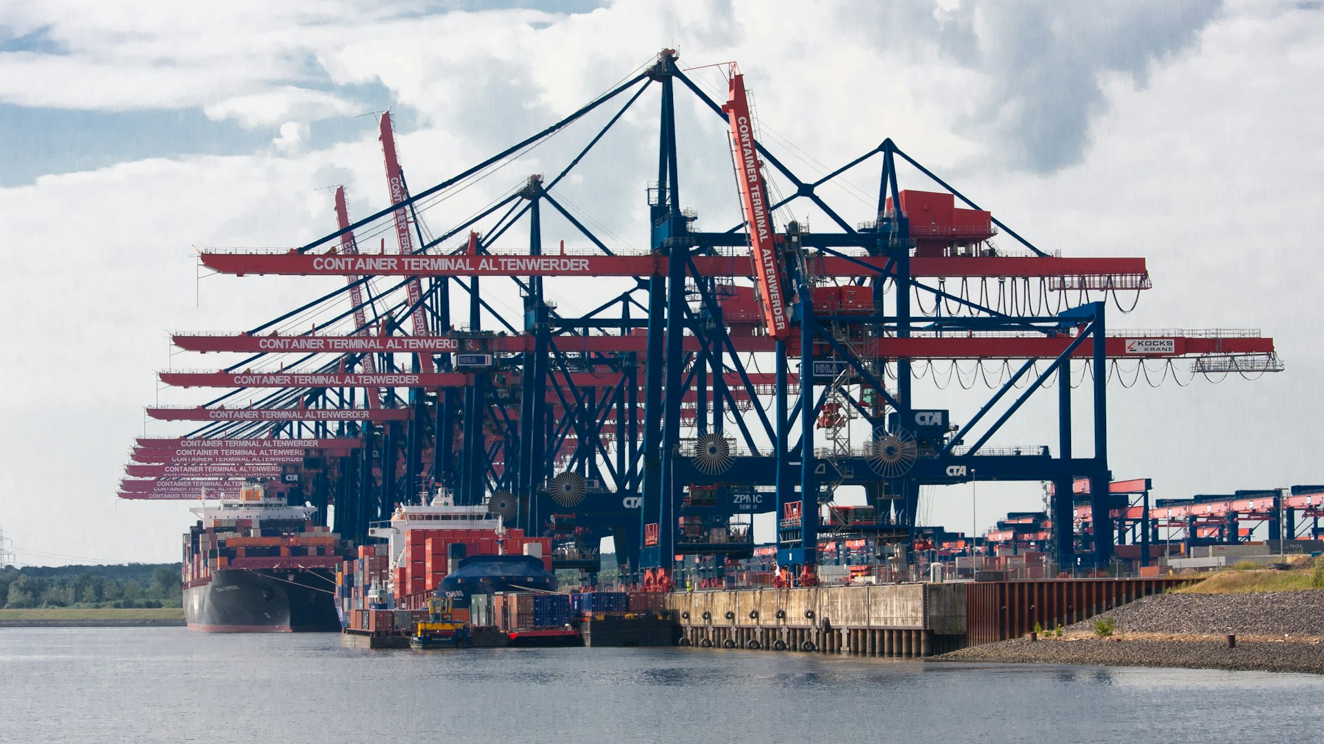 red and blue cargo ship on sea during daytime